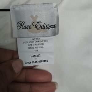 Rare Editions White and Gold Logo Dress Label